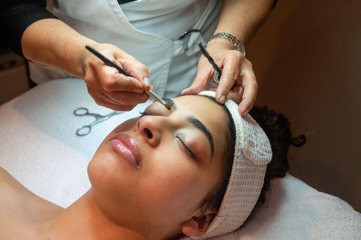 Client during eyebrow design at Cleise Spa